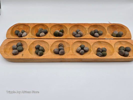 Ayo olopon( Hand carved wooden board game ) with seeds
